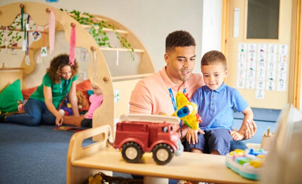  A happy, refreshed parent laughing and playing with their toddler after taking time for self-care.