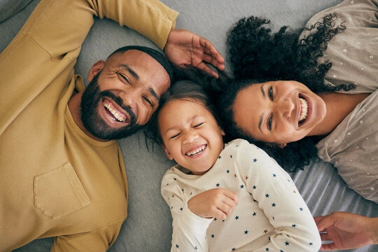 A happy parent smiling and bonding with their baby after seeking help for anxiety.