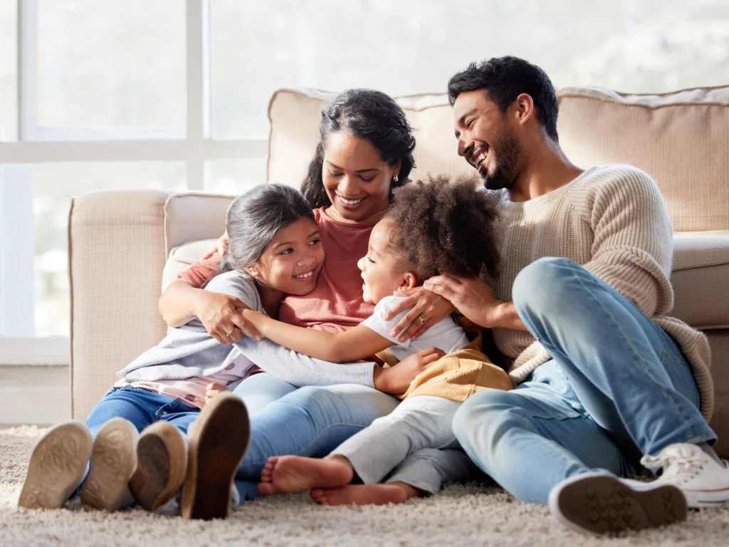 A parent and their teenager sitting together and talking, showing how the parent-child bond benefits the parent's happiness.