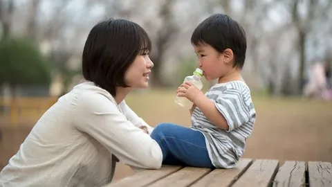 A close-up of a parent making empathetic eye contact with their child, showing the concept of emotional attunement.
