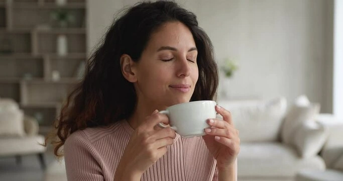  A parent takes a quiet moment with a cup of tea, a gentle first step to managing high-functioning anxiety.