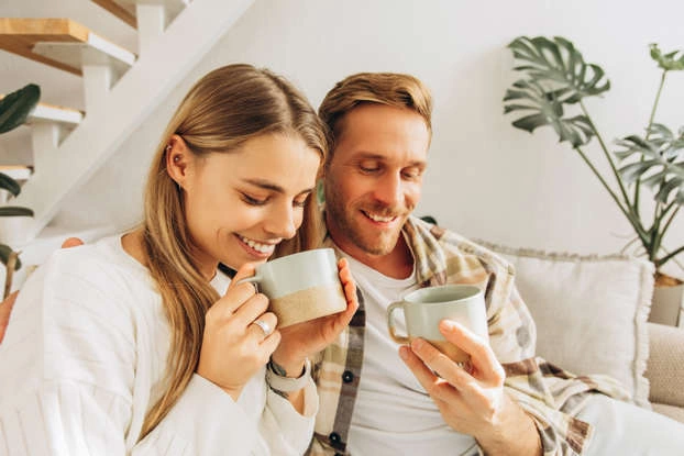  A parent taking a quiet moment to breathe and reflect while holding a coffee cup.