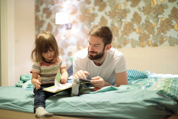  A father reading a bedtime story to his child, focusing on the bond between them.

