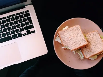 A plate of snacks placed near a teenager's laptop as a non-verbal gesture of love.