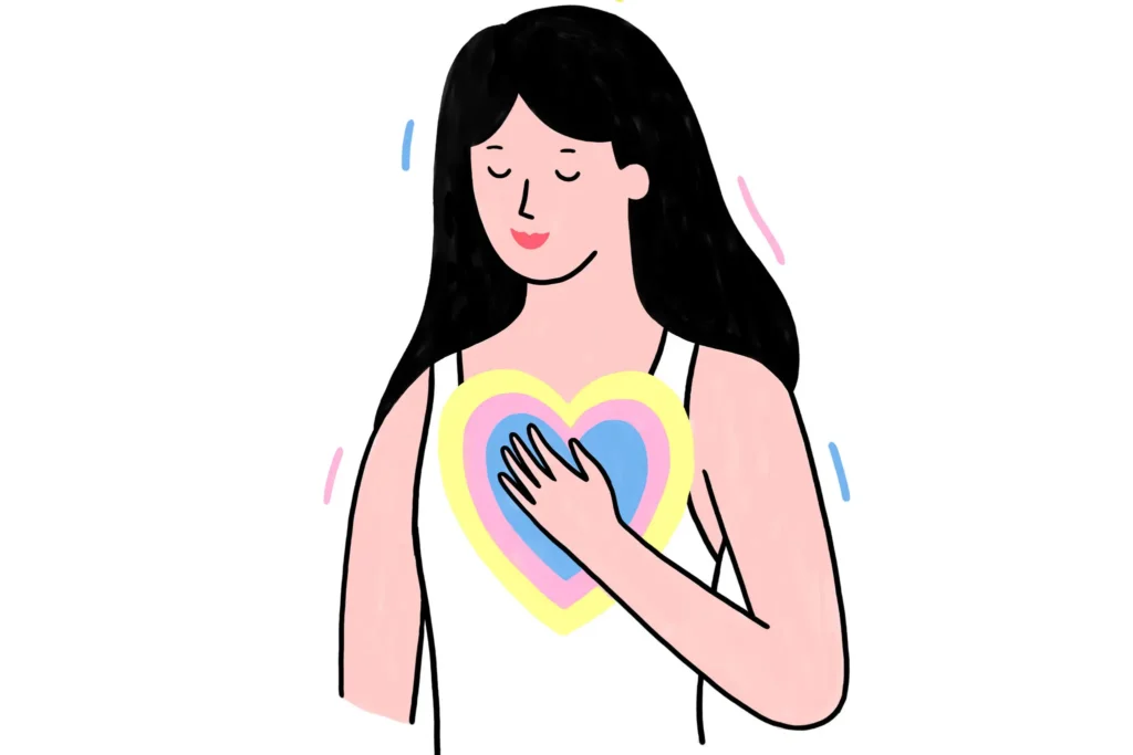 A parent places their hands over their heart in a gesture of self-compassion, a key mental tool for managing anxiety.