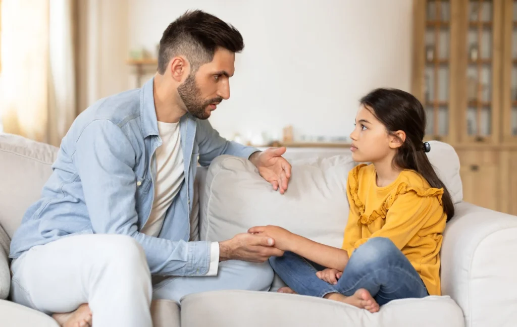 A parent having a calm, respectful conversation about boundaries with a family member