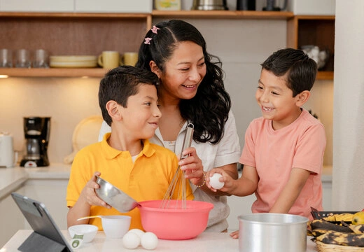 Family with young children baking together as a weekend family ritual
