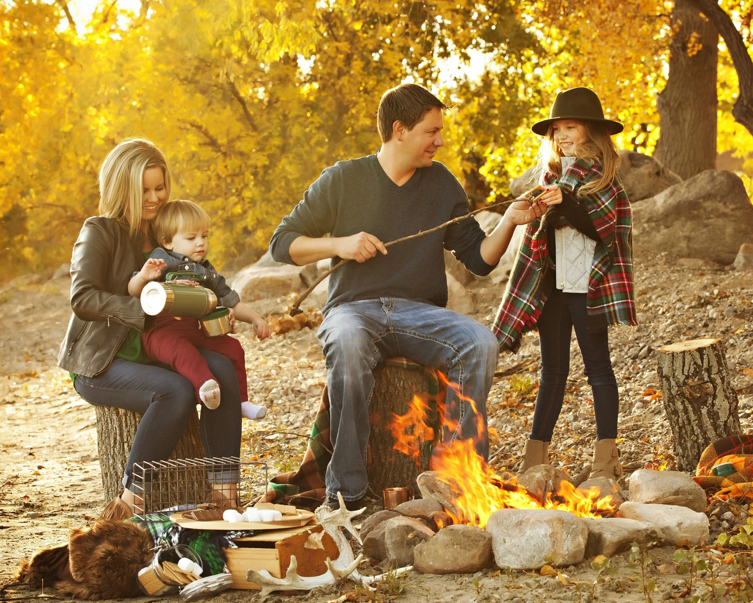 Family enjoying a seasonal outdoor tradition together in autumn, a type of meaningful family ritual